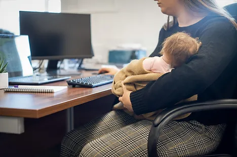 Kid sitting on woman lap