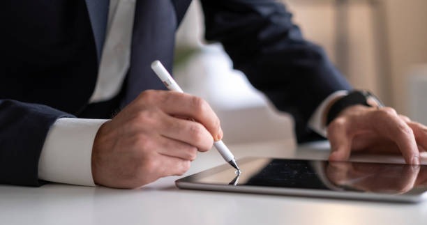 Employee signing a contract. 