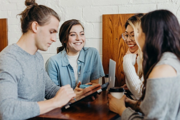 employees at work collaborating office policy handbook