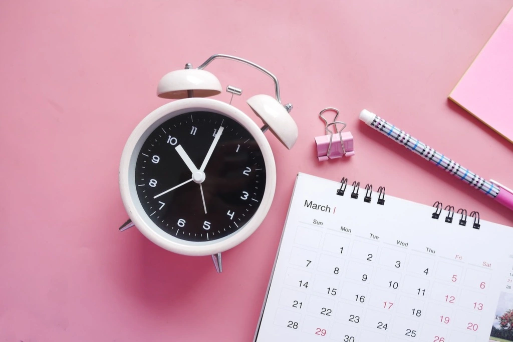 clock on pink background